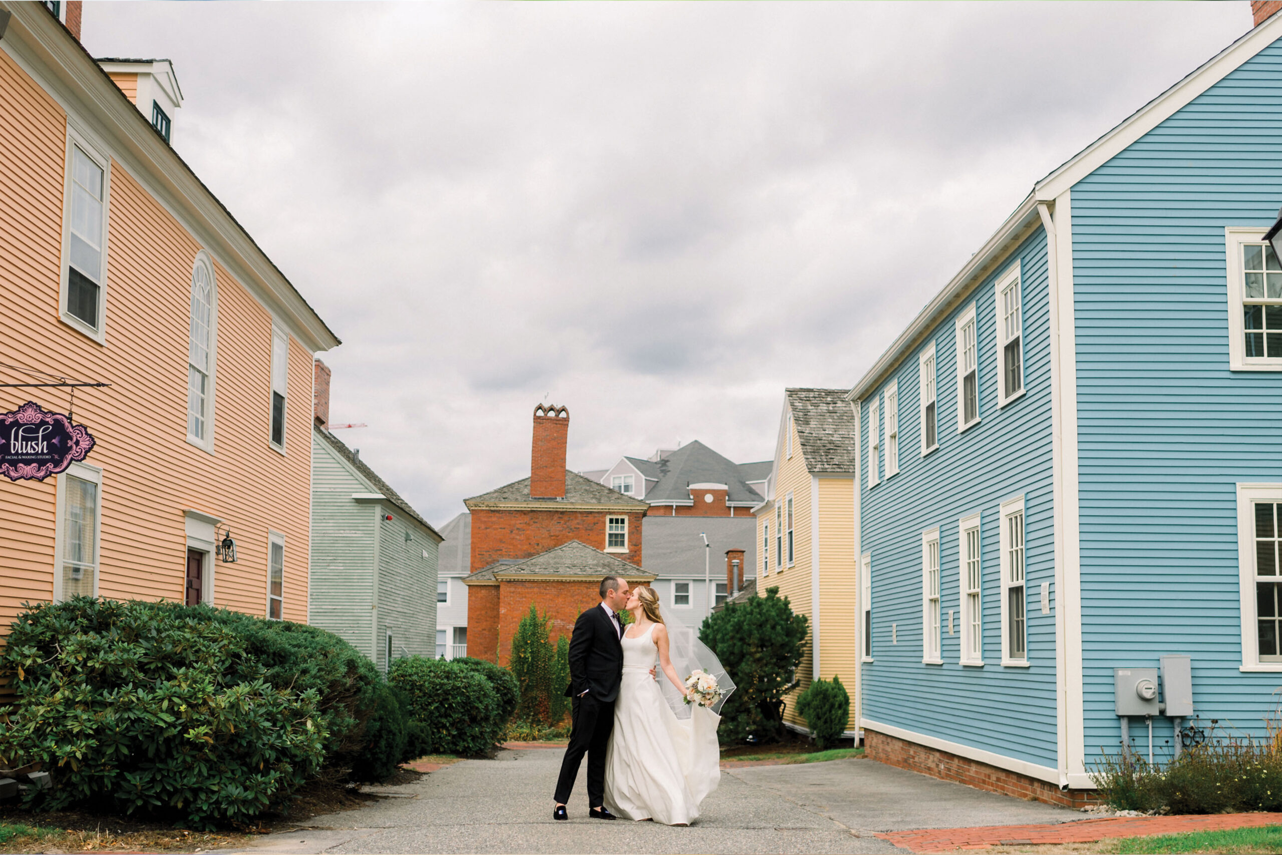 Bride and groom kissing in town of Portsmouth New Hampshire