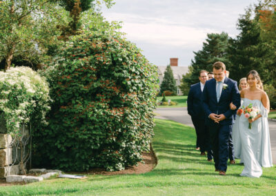 Bride and groom walking together outdoors