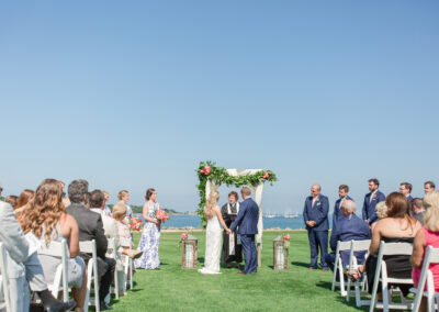 Bride and groom at seaside wedding altar