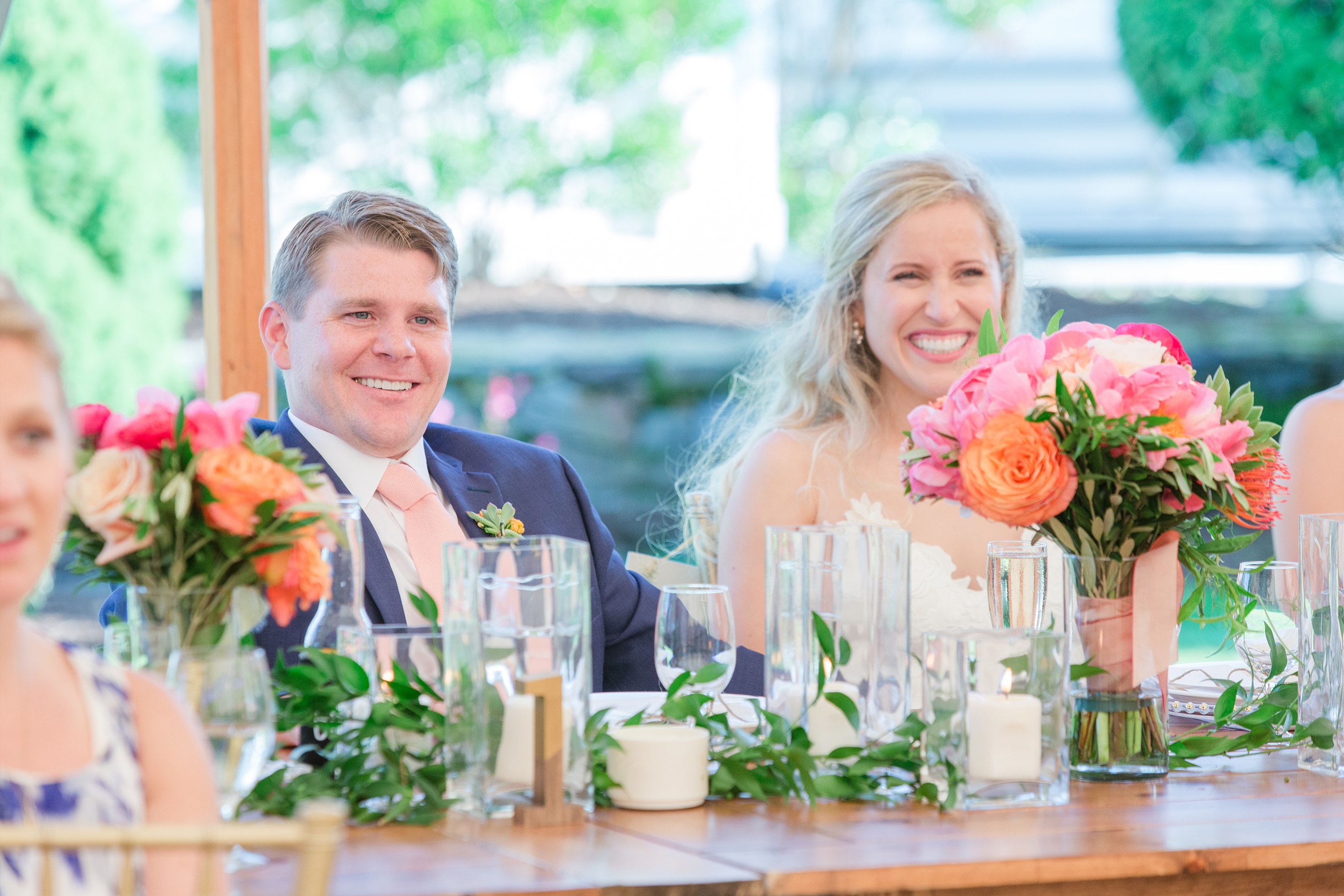 Groom and bride sitting at table