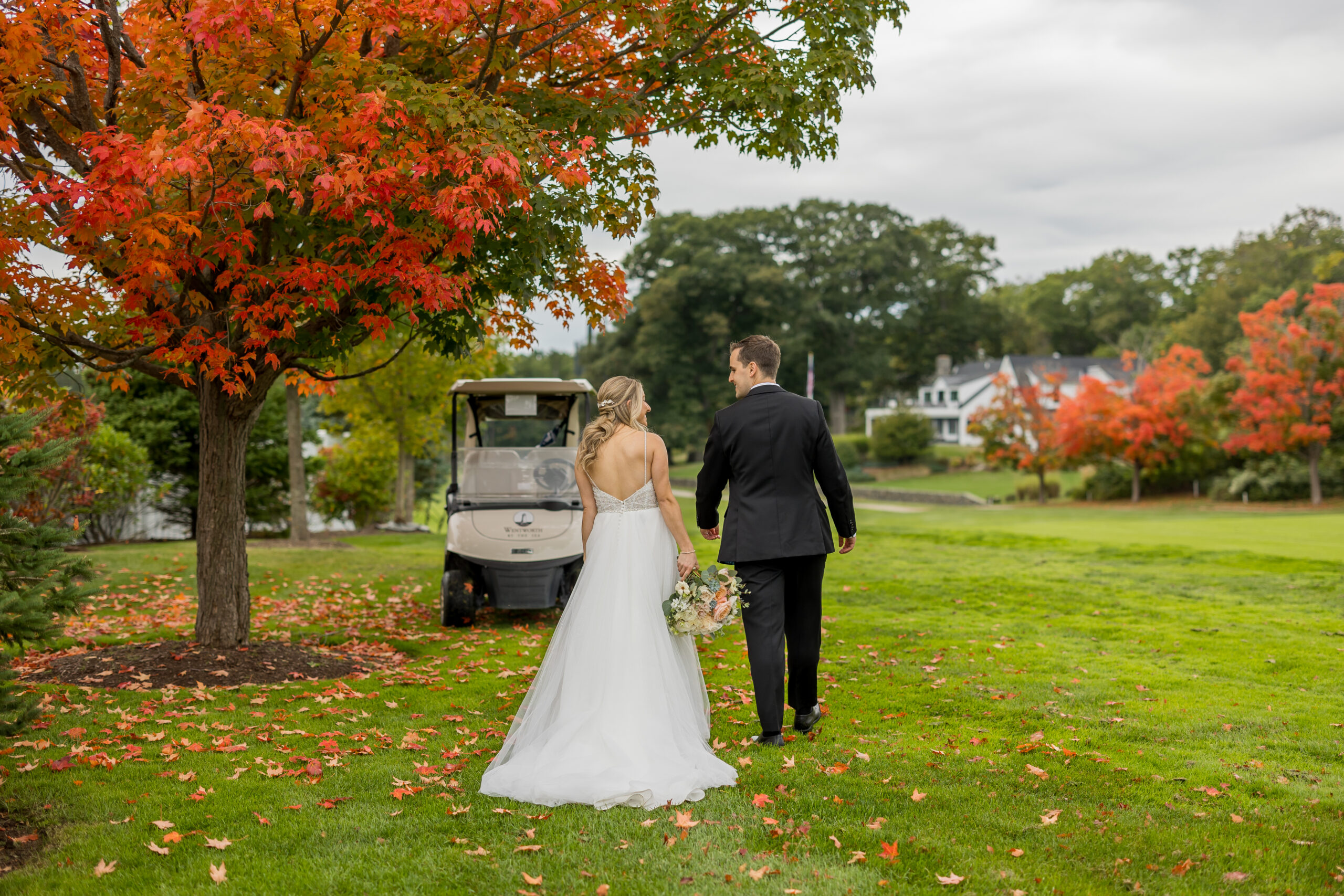 Couple at wedding with a sperry tent behind them