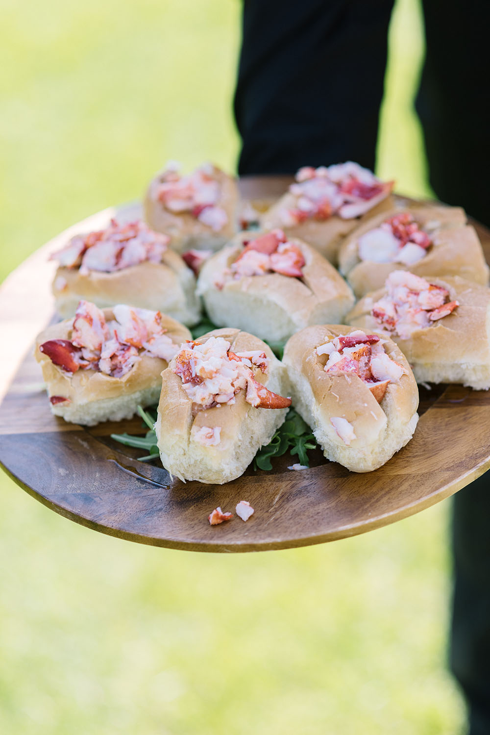 Lobster roll being served at cocktail hour at a Wentworth Weddings wedding