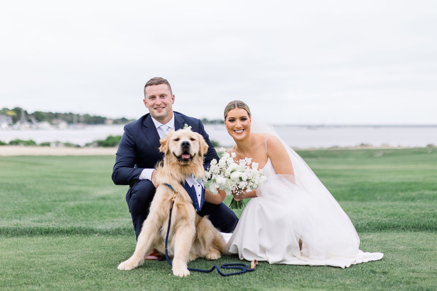 Couple at wedding with a sperry tent behind them