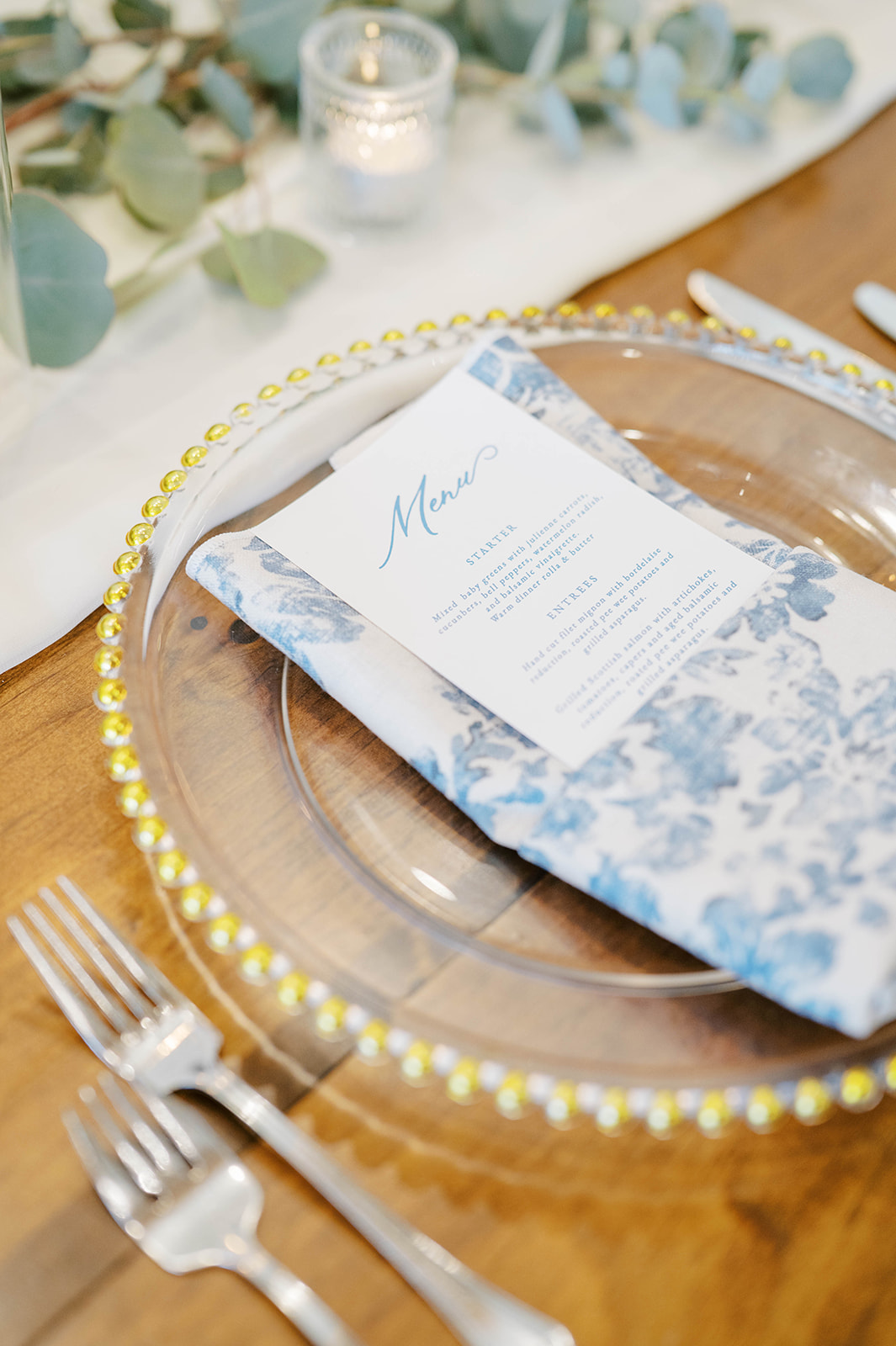 A beautifully decorated wedding reception featuring elegant blue and white color themes, creating a romantic atmosphere.