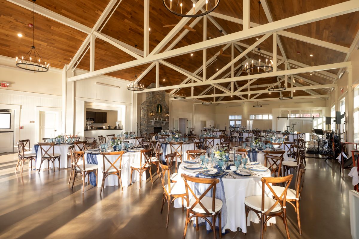 A luxurious reception hall at the inn at the cove, elegantly decorated for an indoor wedding celebration.