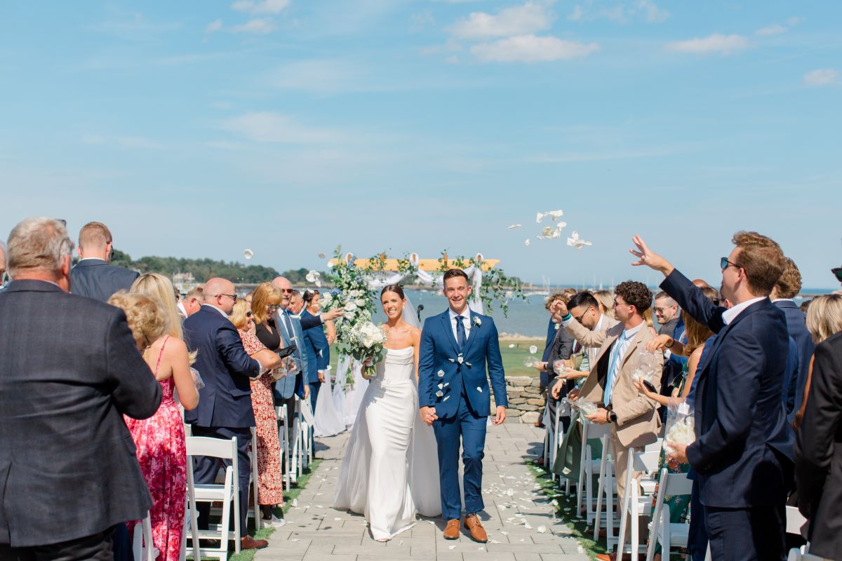 Elegant seaside wedding ceremony in New Hampshire, set against a picturesque beach backdrop.