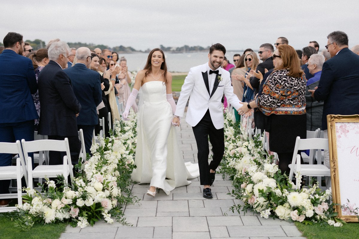 Elegant wedding ceremony at the luxurious Club at the Bay, featuring beautiful decor and a scenic waterfront backdrop.